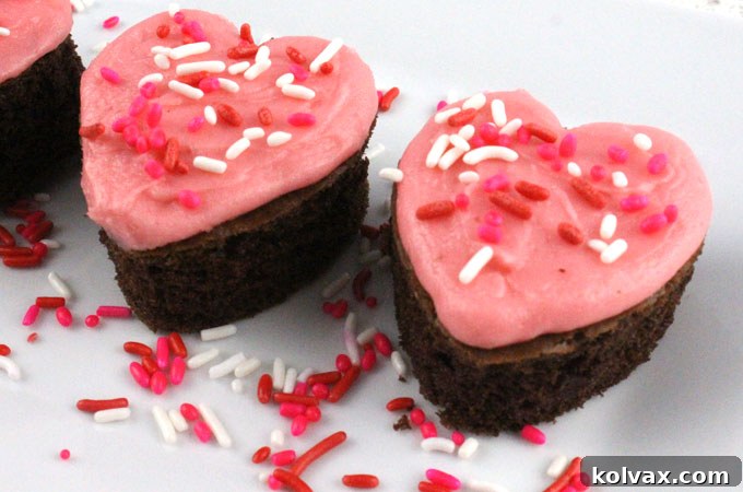 Delicious Valentine's Cake Bites with pink buttercream and sprinkles, perfect for Valentine's Day parties.
