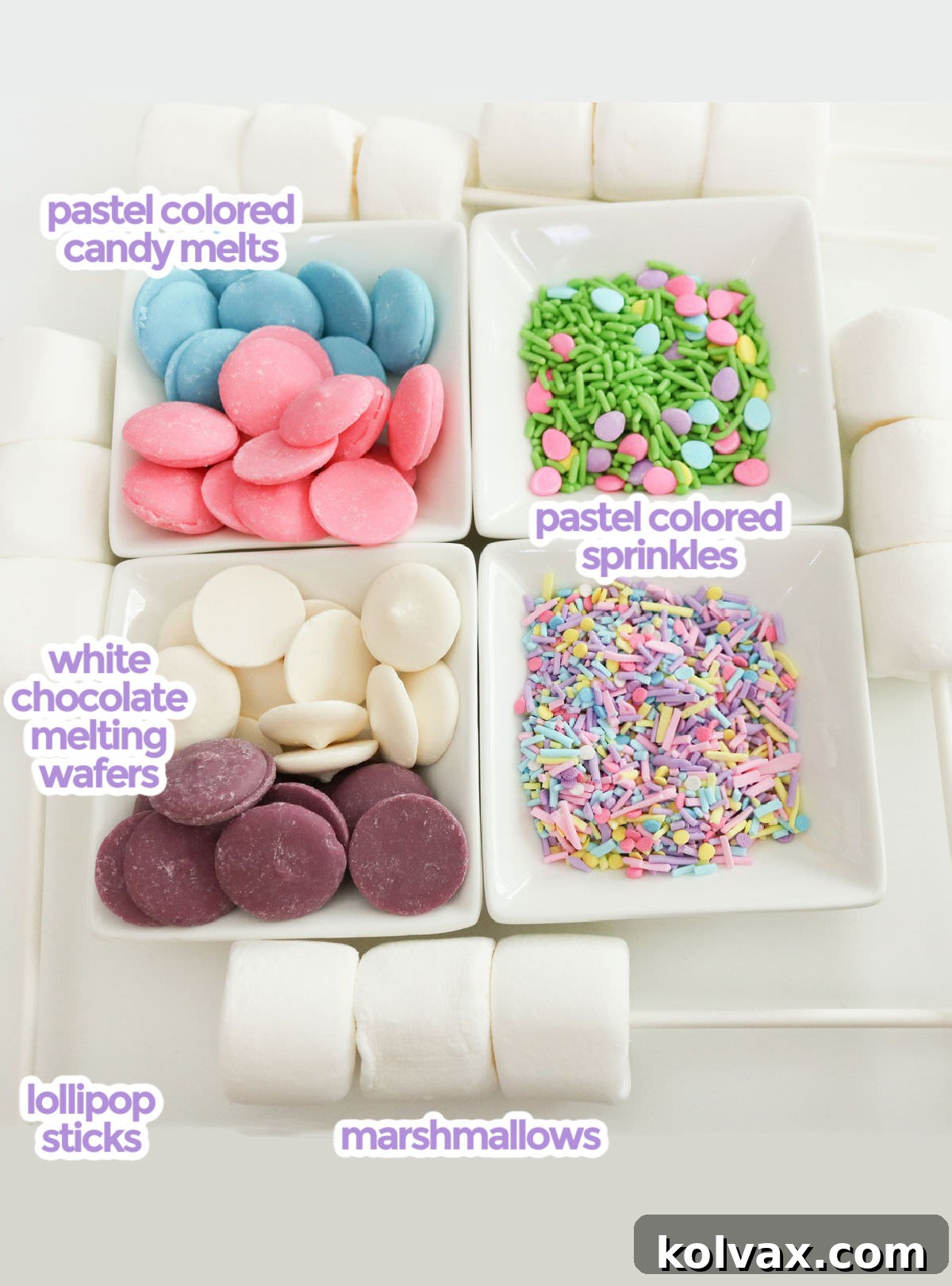 All the ingredients necessary to make Springtime Marshmallow Pops including marshmallows, lollipop sticks, candy melts, white chocolate and sprinkles.