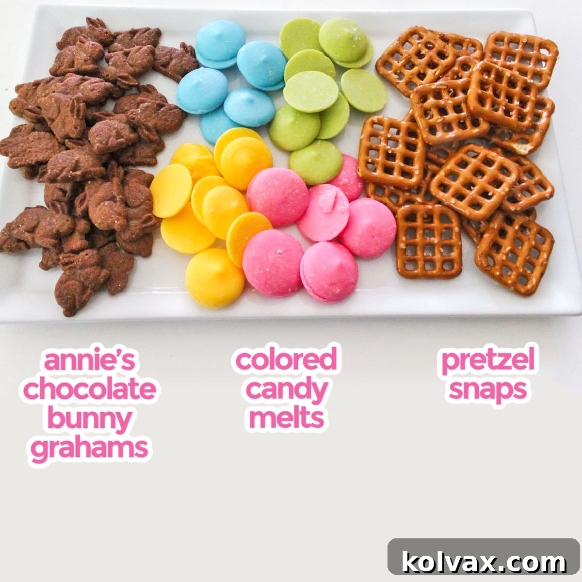 All the ingredients you will need to make Chocolate Bunny Pretzel Bites including Annie's Chocolate Bunny Graham, Colored Candy Melts and Pretzel Snaps.